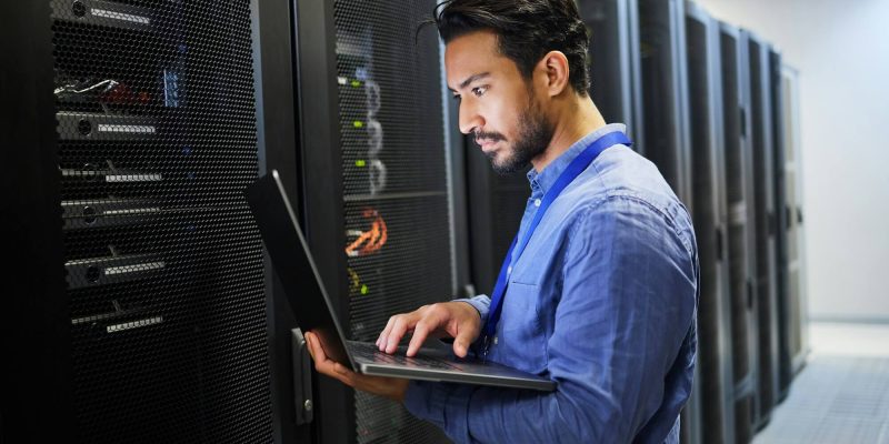 programming-data-center-and-a-man-with-a-laptop-for-maintenance-cyber-security-and-internet-check.jpg programming-data-center-and-a-man-with-a-laptop-for-maintenance-cyber-security-and-internet-check.jpg